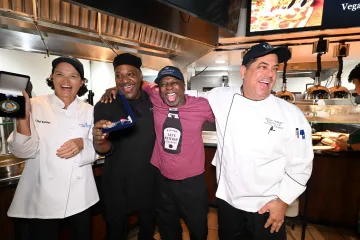 Chef Mike awarded President Armstrong the medal for the egg cracking competition