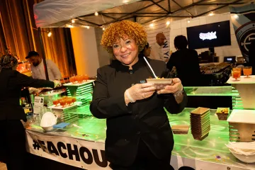 Staff holding a plate of food