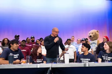 Irvine holding microphone