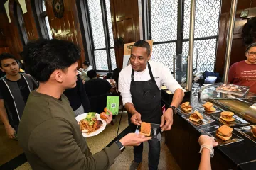 Chef Scott serving sandwiches