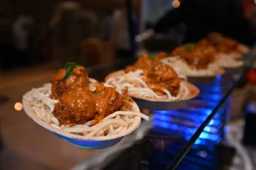 Udon noodles topped with a Thai coconut curry sauce and "meat" balls
