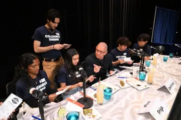 The judges deliberate the event winner