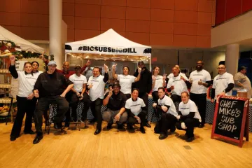 Chef Mike's Sub Shop staff in front of their tent