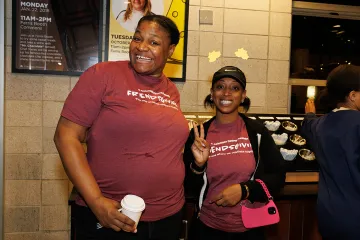 Staff smiling at the camera