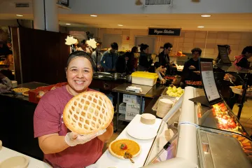 Staff holding pie