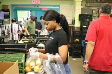 Natasha packing a pantry package