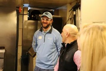 Ferris manager talking with the tour group