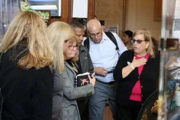 Vicki Dunn talking with a few of the representatives from the tour group