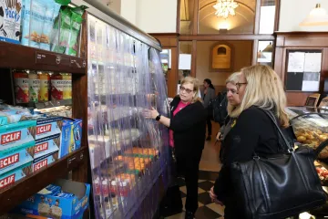 Vicki Dunn showing the refreshment cases to members of the tour group