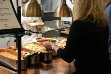 US Army representatives sampling a meal at John Jay Dining Hall