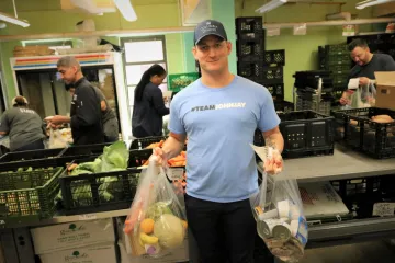 Charlie holding pantry packages