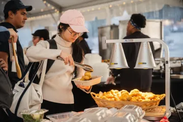 Student getting Garlic Knots