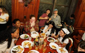 students laughing while they eat