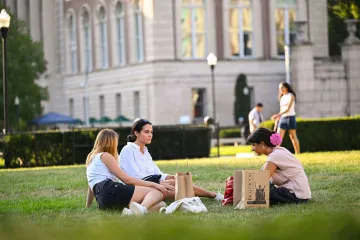 Students sitting on the lawn