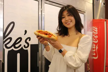 Sarah holding the siracha seitan sub