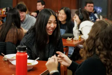 Students chatting in John Jay Dining Hall