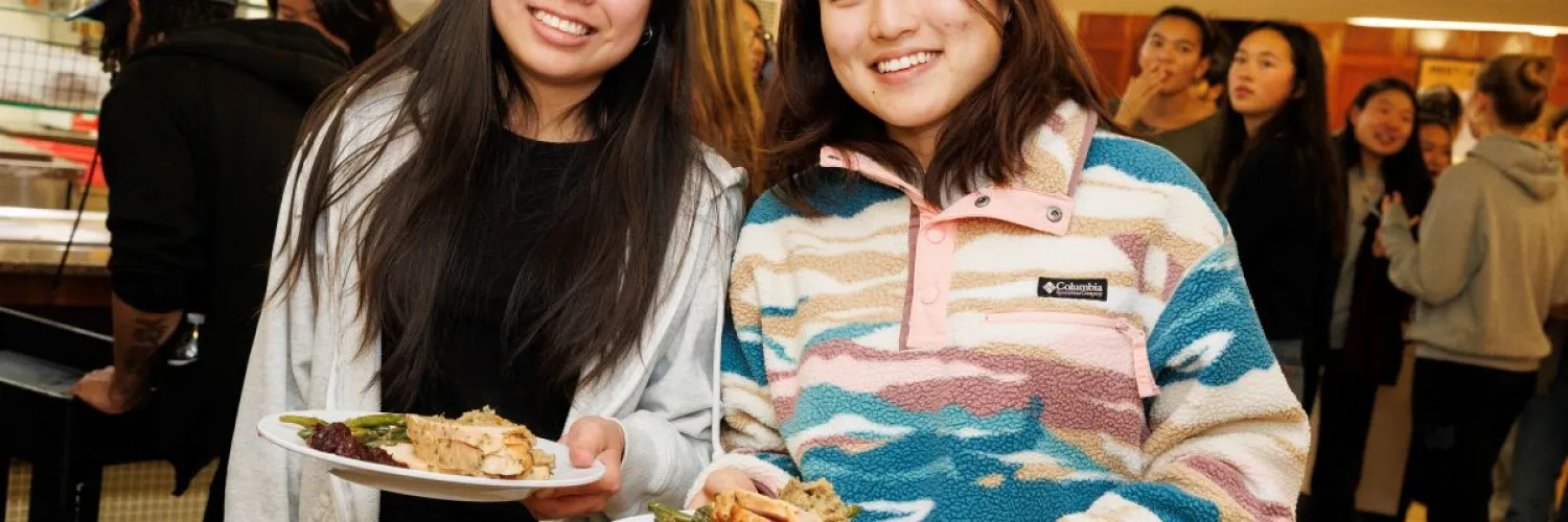 Students holding plates of turkey