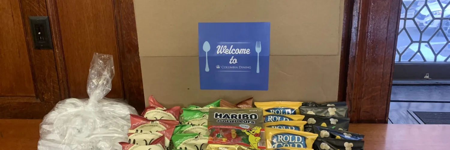 A Welcome Columbia Dining Box with all of its contents - snacks, disposable flatware, condiments and more.
