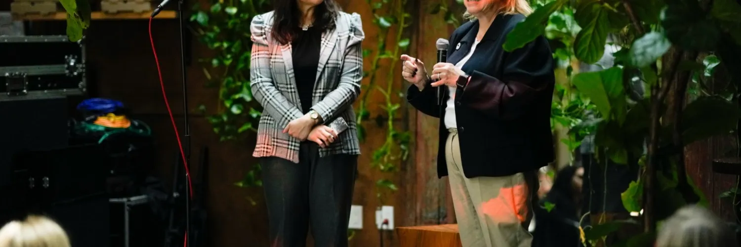 Samreen Afzal and Vicki Dunn speak on stage